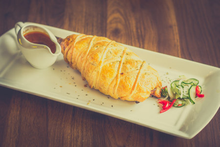 Slow-cooked, fall off the bone lamb shank rendang wellinton encrusted in buttery pastry