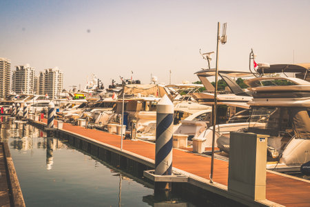 a marina of luxury yachts parked at Sentosa Cove Singaporeの写真素材