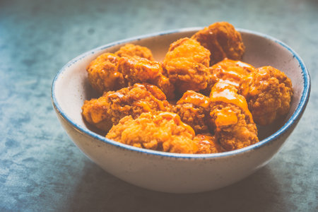 Laksa Popcorn chicken with Laksa Mayonnaise Dip served in a bowlの写真素材