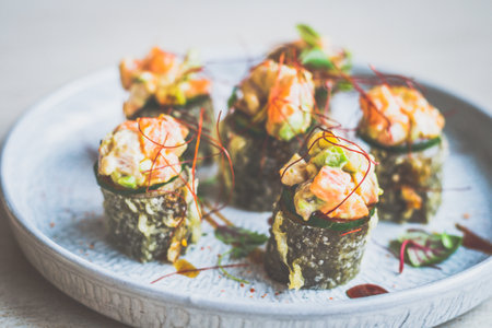 Deep fried mixed seafood maki roll, raw seafood medley, homemade sriracha sweet soyの写真素材