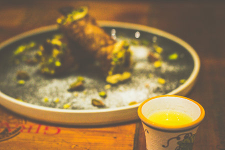 Italian dessert of SICILIAN CANNOLI RICOTTA CHEESE served with chocolate and pistachioの写真素材