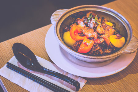 Three Cup Beef with tenderloin beef, bell pepper, onions and basilの写真素材