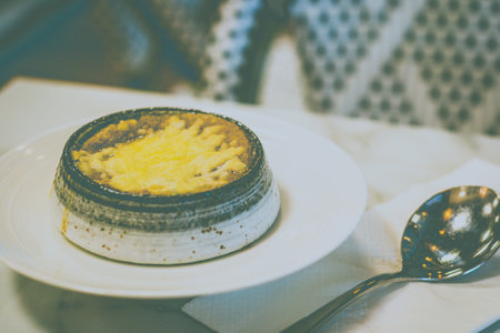 Fresh Onion Soup with caramelized onions, savoury beef stock, brioche bread and emmental cheeseの写真素材