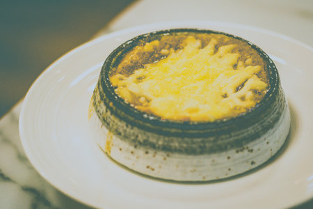 Fresh Onion Soup with caramelized onions, savoury beef stock, brioche bread and emmental cheeseの写真素材
