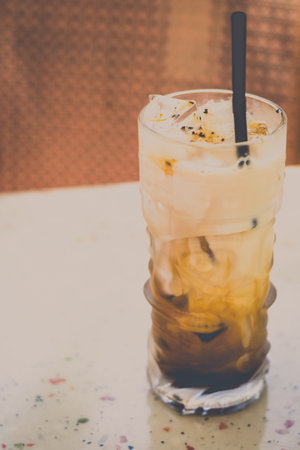 iced latte with espresso and milk and ice in a glassの写真素材