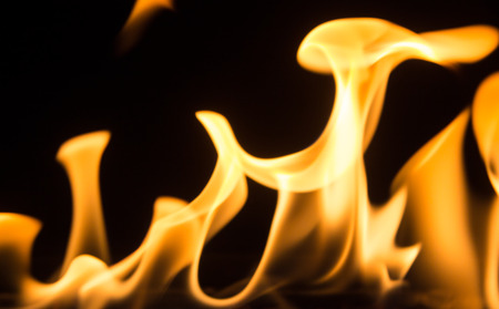 bright orange smokeless flame on a black backgroundの写真素材