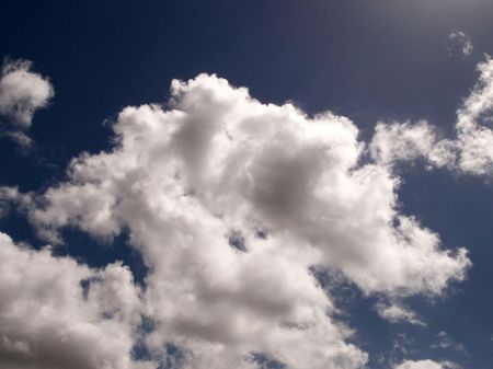 A mushroom shaped cloud on the blue sky.の写真素材