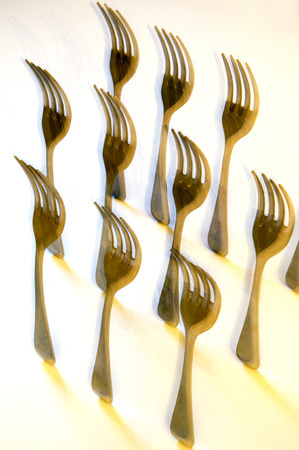 Photograph of a group of forks standing in the studio with strobe and moving the holdersの写真素材