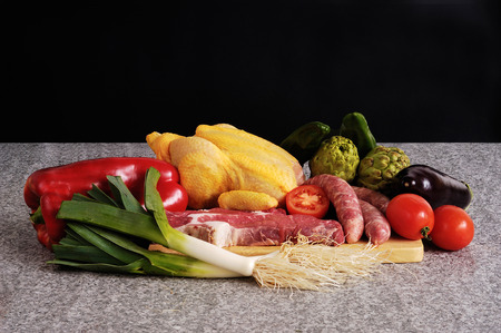 vegetables and meat with chicken and beef, with black backgroundの写真素材