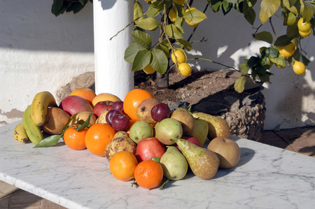 Still life of fruit with sunlight outside,の写真素材