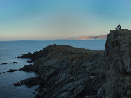 watching the sunset, Cap Ras, Colera, Costa Brava, Spainの写真素材