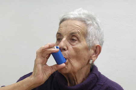 old woman with an inhalerの写真素材