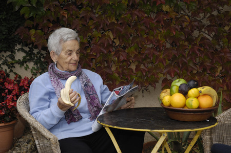 senior  woman with a bananaの写真素材