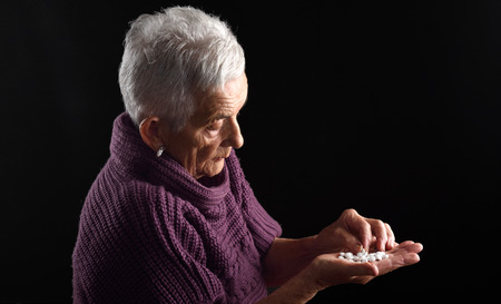 Senior woman looking a pillの写真素材
