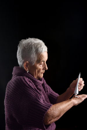 Senior woman with ointmentの写真素材