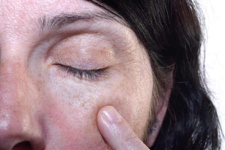 Wrinkles in the eyes of a middle-aged woman 40-45 yearsの写真素材