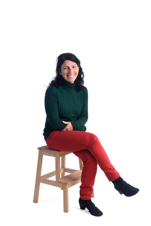 Portrait of a woman sitting with white backgroundの写真素材
