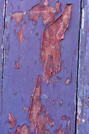 Remains of paint on old wood,red,liac, violetの写真素材