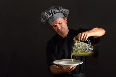 Chef preparing a bowl of soupの写真素材