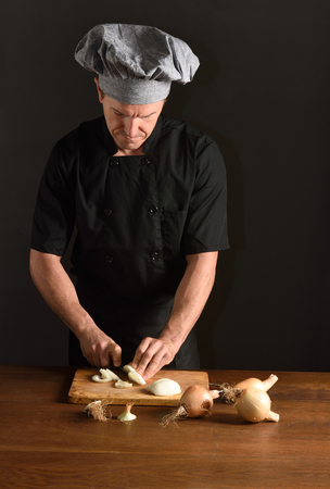 chef chopping onionsの写真素材