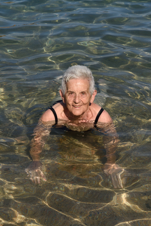 Senior woman enjoying the beachの写真素材