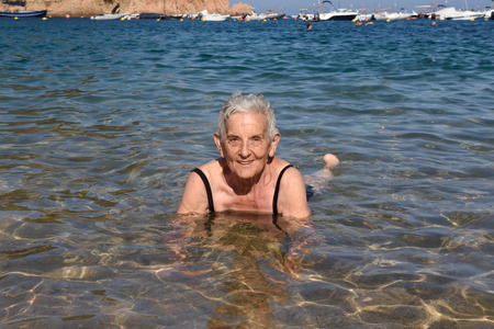 Senior woman enjoying the beachの写真素材