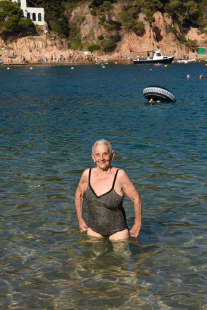 portrait of a woman entering the seaの写真素材