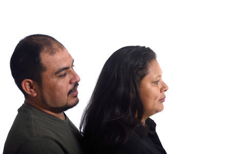 Portrait of a couple in profile on white backgroundの写真素材