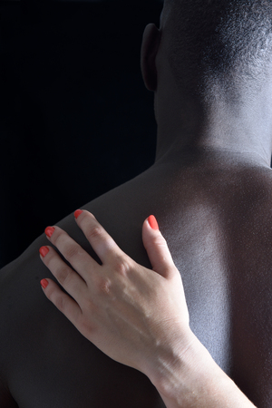 A caressed back on black backgroundの写真素材
