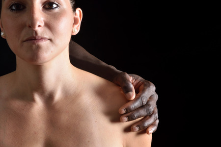 Portrait of a mixed couple on black backgroundの写真素材