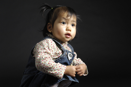 Portrait of a chinese girl on black backgroundの写真素材
