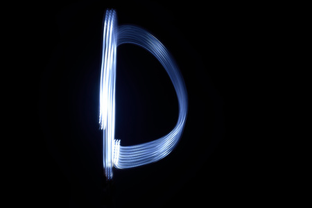 paint with light on black background letter Dの写真素材