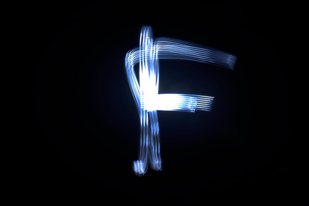 paint with light on black background letter Fの写真素材