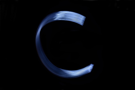paint with light on black background letter Cの写真素材