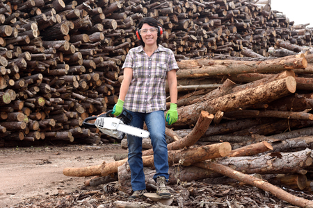 portrait of a woman with a chainsawの写真素材