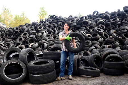 woman in a tire recycling plantの写真素材