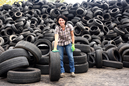 woman in a tire recycling plantの写真素材