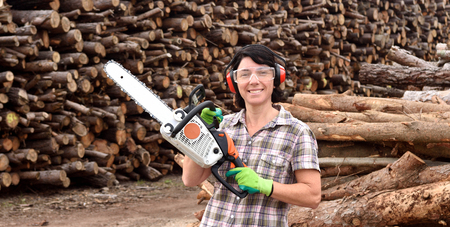 portrait of a woman with a chainsawの写真素材