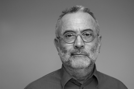 middle-aged man with blue shirt and glassesのeditorial素材