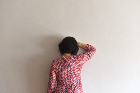 Opposite woman on her back on a wallの写真素材