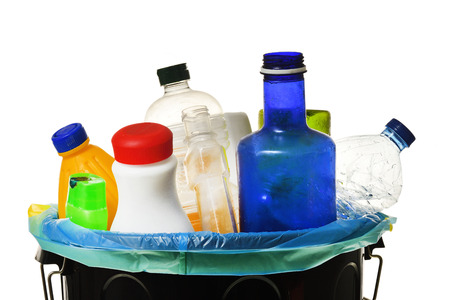garbage bin full of bottles to recycle on whiteの写真素材