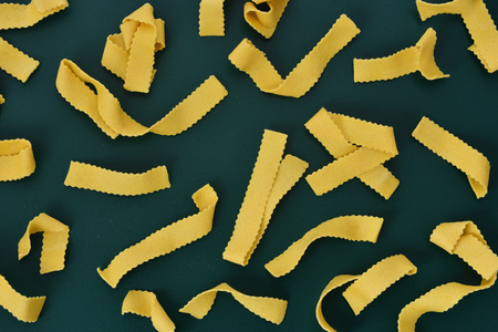 tagliatelle with green backgroundの写真素材