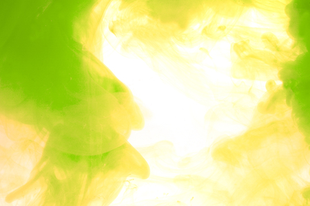 color dissolved in water with white backgroundの写真素材