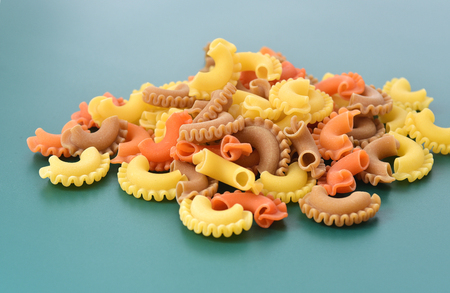 Pasta creste di gallo on green backgroundの写真素材