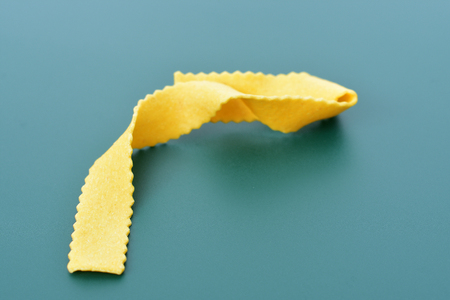 tagliatelle with green backgroundの写真素材
