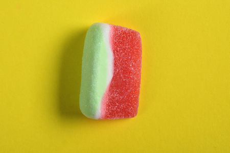 watermelon candy on yellow backgroundの写真素材