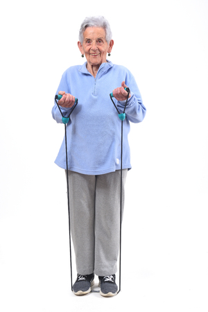 senior woman exercising on white backgroundの写真素材