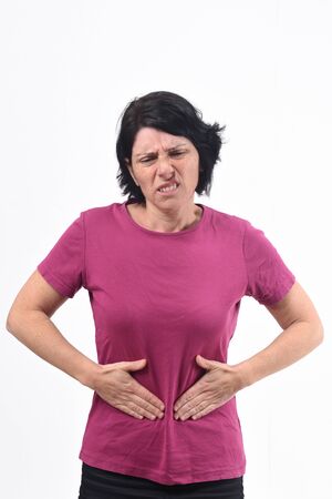 woman with pain on belly on white backgroundの写真素材