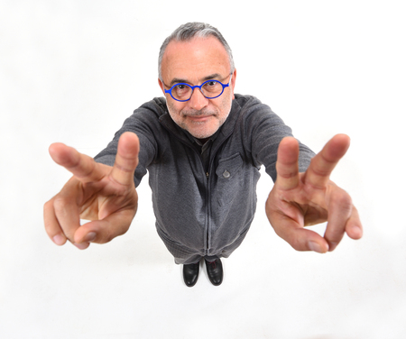 man making the victory sign on a white background