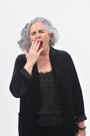 woman yawning on white backgroundの写真素材